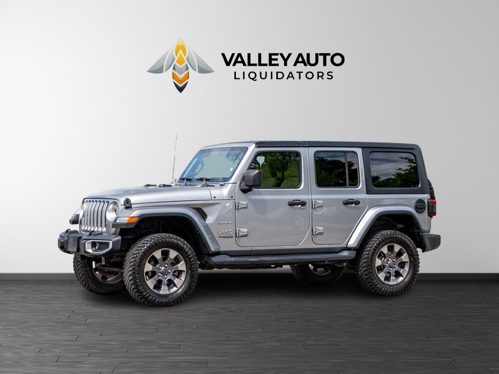 2018 Jeep Wrangler Unlimited Sahara in Silver — front three-quarter view