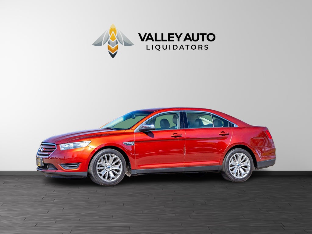2014 Ford Taurus Limited in Maroon — front three-quarter view