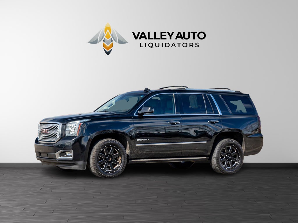 2016 GMC Yukon Denali in Black — front three-quarter view